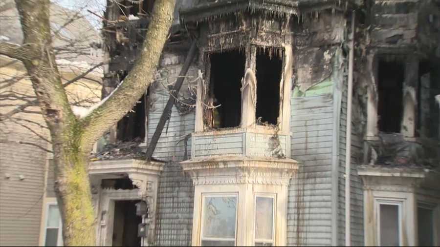 A woman was killed trying to escape a 3-alarm fire inside her Cambridge home on Wednesday morning.