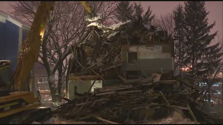 A triple-decker home in the city of Worcester that appeared to be in danger of collapsing was torn down Wednesday evening.