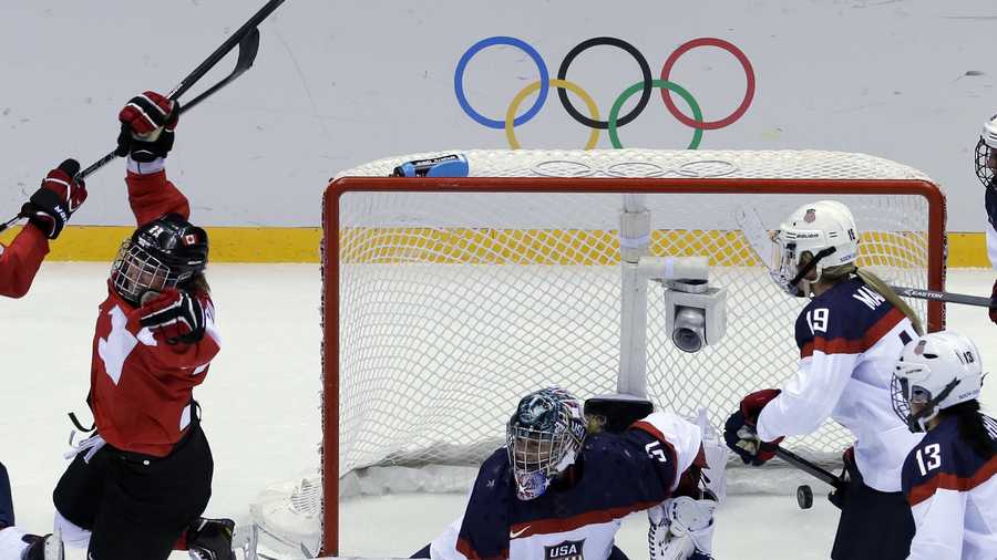 Marie-Philip Poulin of Canada (29) reacts after scoring past USA goalkeeper Jessie Vetter (31) of the women's gold medal ice hockey game at the 2014 Winter Olympics, Thursday, Feb. 20, 2014, in Sochi, Russia.