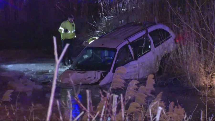 A crash sent a minivan into the water and four people to a local hospital Saturday night, Milford police said.