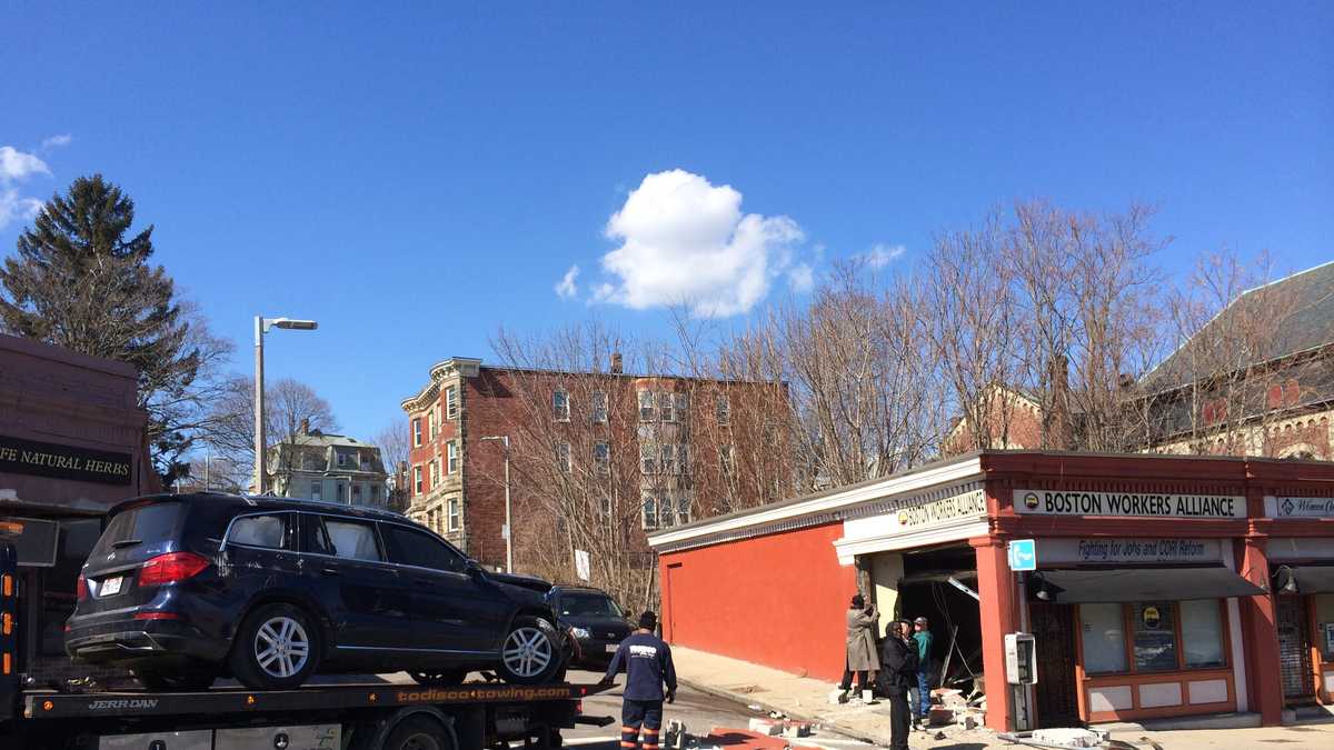 Photos: Car crashes into building after shooting