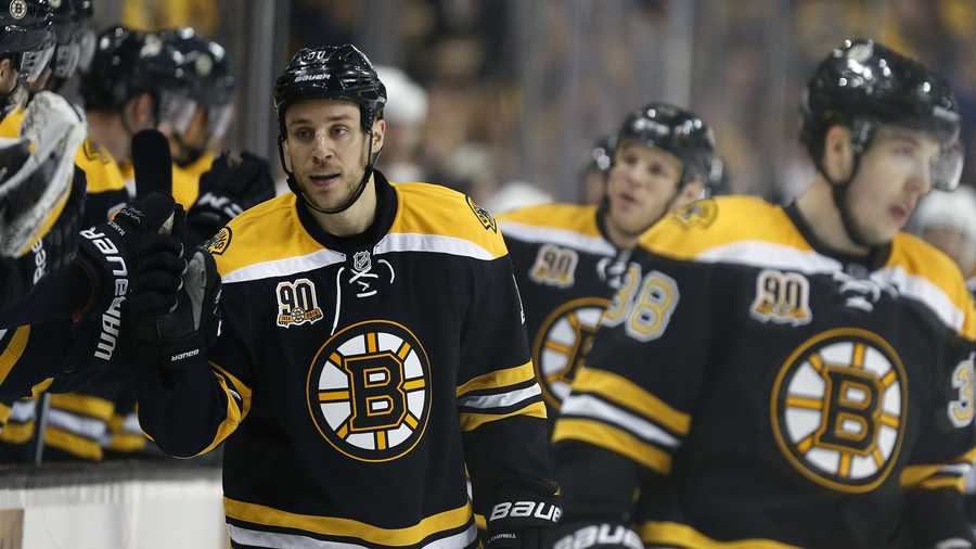Boston Bruins' Gregory Campbell (11) celebrates his goal in the first period of an NHL hockey game against the Buffalo Sabres in Boston, Saturday, April 12, 2014. (AP Photo/Michael Dwyer)