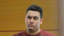 Erick Figueroa, 22, of Framingham, is arraigned on charges of rape of a child and indecent asault and battery on a child in Framingham District Court Wednesday.