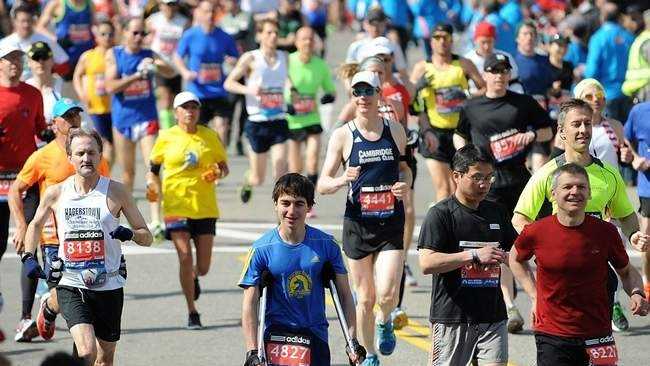 Determined high school student runs marathon on crutches