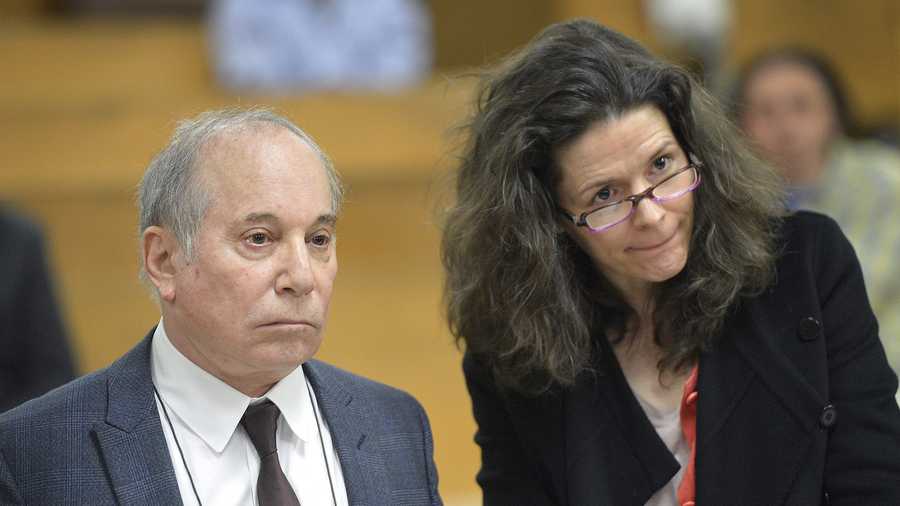 Singer Paul Simon, left, and his wife Edie Brickell appear at a hearing in Norwalk Superior Court on Monday April 28, 2014 in Norwalk, Conn.
