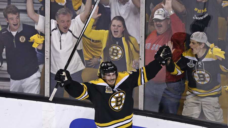 Boston Bruins left wing Loui Eriksson (21) celebrates his goal against Montreal Canadiens goalie Carey Price during the third period of Game 5 in the second-round of the Stanley Cup hockey playoff series in Boston, Saturday, May 10, 2014.