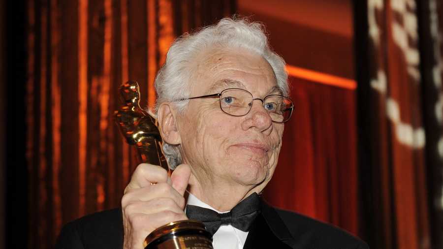 In this Nov. 14, 2009 file photo, cinematographer Gordon Willis poses with his honorary Oscar following The Academy of Motion Picture Arts and Sciences 2009 Governors Awards in Los Angeles. An official at the Chapman Cole & Gleason funeral home in Falmouth, Mass. on Monday, May 19, 2014 confirmed that Willis, one of Hollywood's most celebrated and influential cinematographers, has died. He was 82.