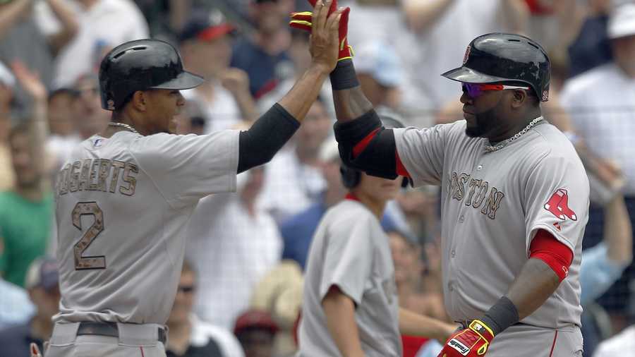 Boston Red Sox's David Ortiz (34) celebrates with Xander Bogaerts (2) after hitting a two run homer during the fifth inning of a baseball game against the Atlanta Braves on Monday, May 26, 2014, in Atlanta, Ga.