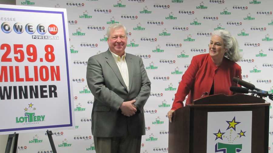 In a photo provided by the Tennessee Lottery, Roy Cockrum, 58, of Knoxville claims his $259.8 million Powerball prize, Thursday, July 3, 2014, in Nashville, Tenn. He is planning to accept a lump sum payment of $115 million. Lottery officials say it's the largest prize ever won in Tennessee Lottery history. Cockrum was presented the prize by Tennessee Lottery CEO Rebecca Hargrove. (AP Photo/Tennessee Lottery)