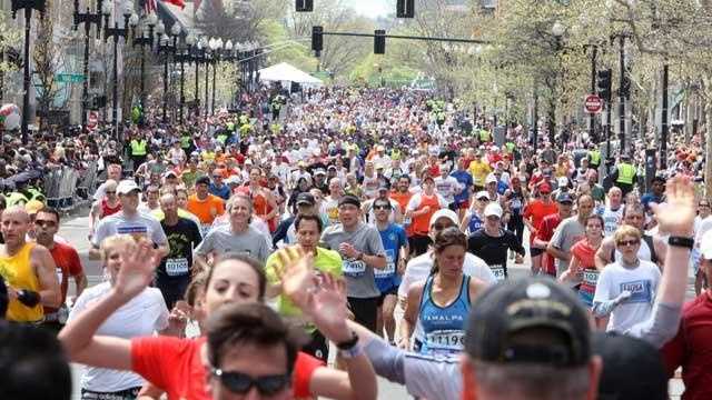Boston Marathon runners head to the finish line on Boylston st. in Boston



