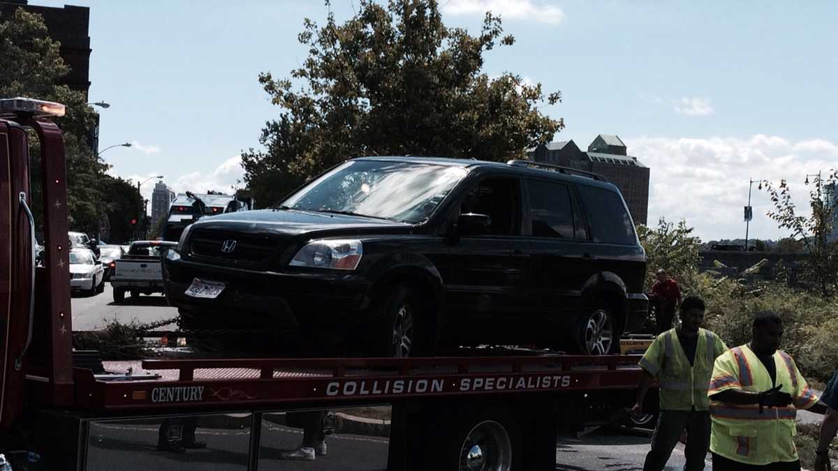 Images: SUV crashes into Charles River