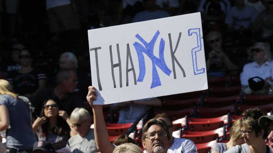 A fan holds up a sign honoring Jeter.