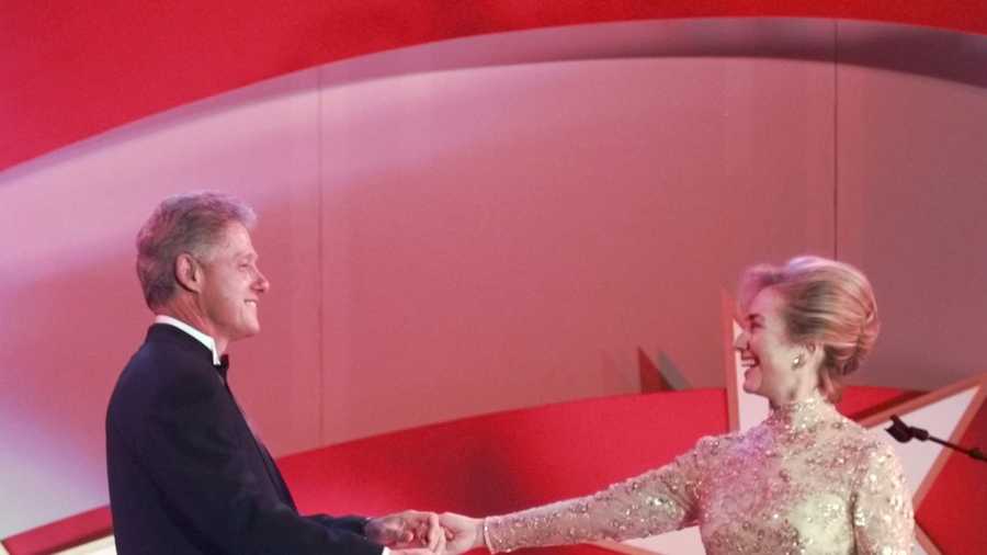 President Clinton begins to dance with his wife Hillary at the Air and Space Ball Monday, Jan. 20, 1997, in Washington. Hillary Clinton's dress was designed by Oscar de la Renta.