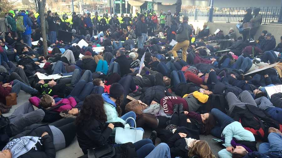Protesters stage a "die-in" near North Station in Boston on Saturday. 