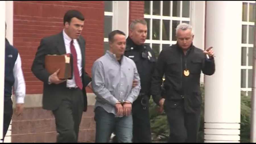 Co-founder and former NECC head pharmacist Barry Cadden is led out of Wrentham Police Department in handcuffs.