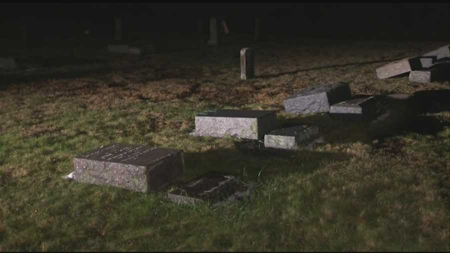 More than 60 gravestones in a Whitman cemetery, including that of a decorated member of the U.S. armed forces, were knocked over Sunday in an apparent act of vandalism.