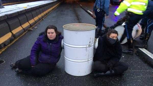 Some members of the group had their arms sealed inside the barrels.
