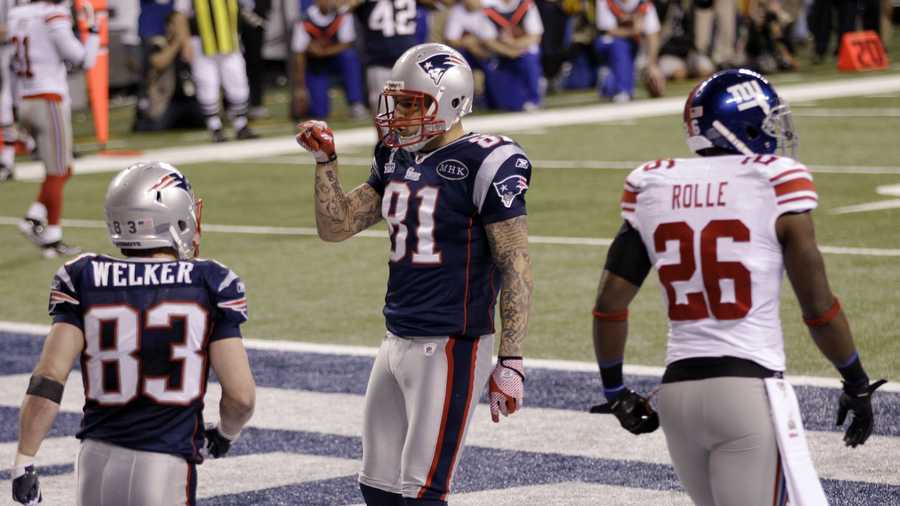 New England Patriots tight end Aaron Hernandez celebrates after scoring a touchdown on a 12-yard pass during the second half of the NFL Super Bowl XLVI football game Sunday, Feb. 5, 2012, in Indianapolis.