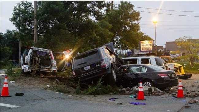 A Range Rover driven by Benjamin Shealey sits atop another vehicle after a July 2013 high-speed police chase that began in Harwich and ended near the Kream N' Kone restaurant on Route 28 in Chatham. A pedestrian was killed and members of the family in the Volvo SUV at left were injured.