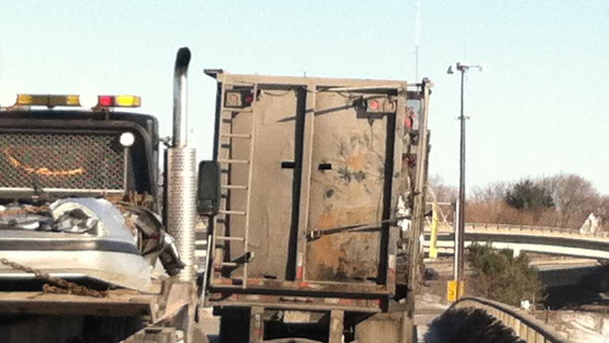 Crushed cars fall off truck on highway