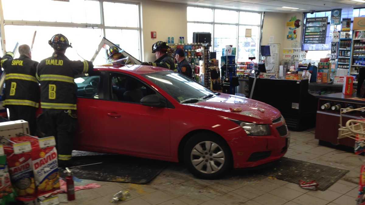 Car smashes into Route 128 convenience store