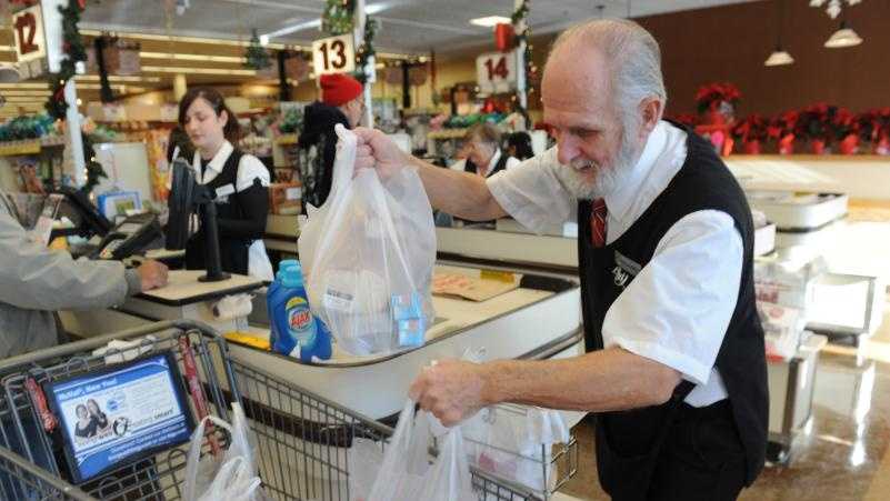Michael Stone of Ashfield puts groceries in plastic bags into a cart at Big Y Supermarket in Greenfield.