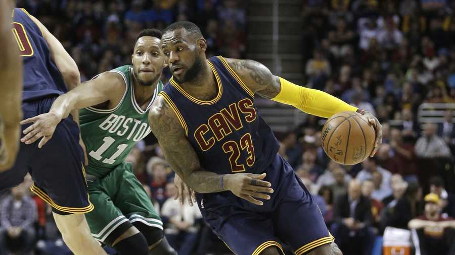 Cleveland Cavaliers' LeBron James (23) drives past Boston Celtics’ Evan Turner (11) during an NBA basketball game Friday, April 10, 2015, in Cleveland.