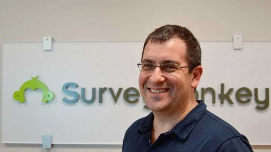 David Goldberg, CEO of online market researcher SurveyMonkey, in front of the company logo at headquarters in Palo Alto, Calif. Goldberg died unexpectedly Friday in Mexico.