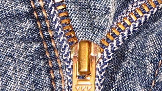 Why Do Most Zippers Say YKK on the Pull-tab?