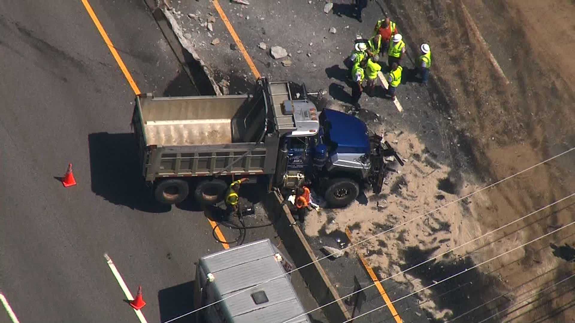 Dump Truck Crashes Into Highway Median