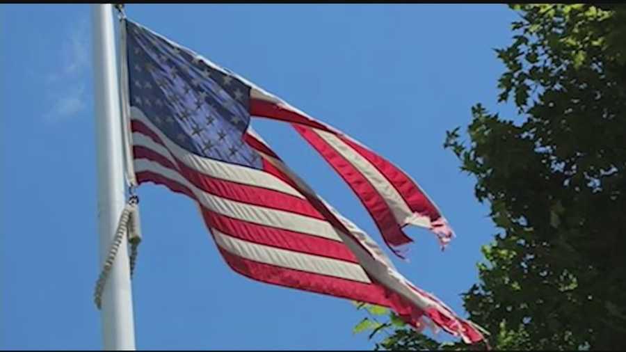 A tattered U.S. flag flying in front of the Huntington, Vt. post office this summer has sparked a series of complaints, which seemed to be ignored until a passerby had an idea Friday.
