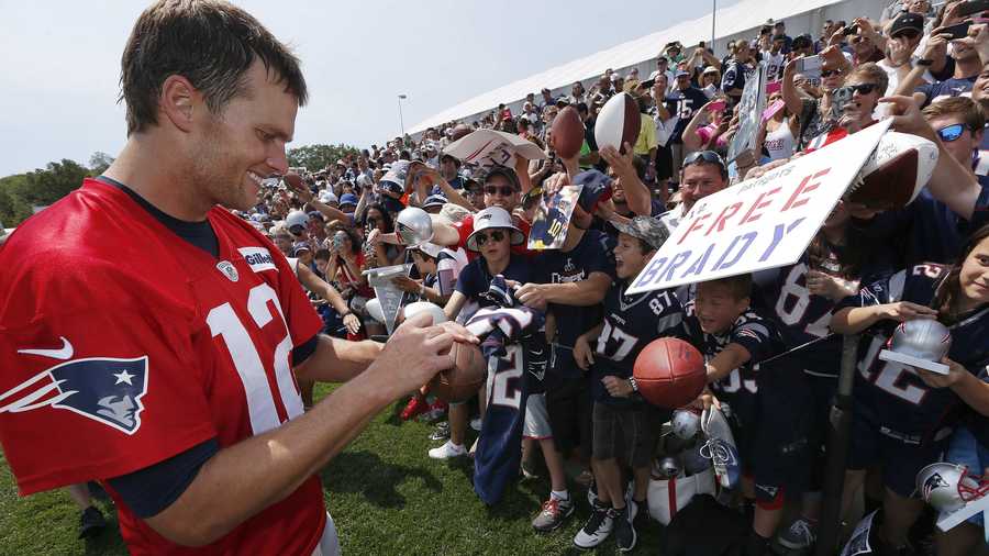 New England Patriots quarterback Tom Brady signs autographs during an NFL football training camp in Foxborough, Mass., Saturday, Aug. 1, 2015.