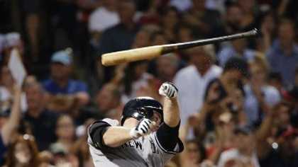 New York Yankees' Brian McCann lets go of the bat after swinging at a pitch in the seventh inning of a baseball game against the Boston Red Sox, Monday, Aug. 31, 2015, at Fenway Park, in Boston. (AP Photo/Steven Senne)