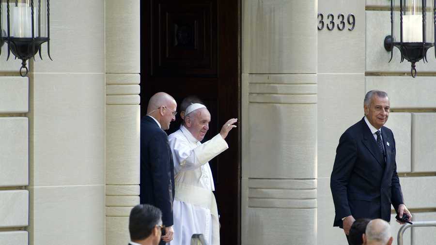 Pope Francis waves as he departs the Apostolic Nunciature, the Vatican's diplomatic mission in Washington, Wednesday, Sept. 23, 2015, for the White House where President Barack Obama will host a state arrival ceremony.