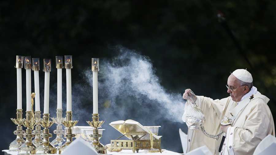 Pope Francis conducts Mass outside the Basilica of the National Shrine of the Immaculate Conception Wednesday, Sept. 23, 2015, in Washington. (AP Photo/David Goldman)