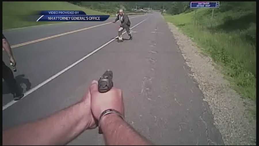 A dashboard camera video released Friday shows two police officers fatally shooting a knife-wielding man as he ran toward them along a rural road in July, then firing several more times after he fell at their feet.
