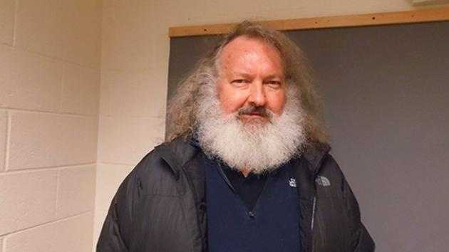 Randy Quaid stands in the Vermont State Police barracks in St. Albans, Vt., Friday, Oct. 9, 2015. State Police say Quaid has been taken into custody trying to cross from Canada.