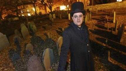 In this Dec. 22, 2003 file photo, Christian Day poses in the Old Burying Ground in Salem, Mass. A judge is scheduled to hear a suit on Wednesday, Oct. 28, 2015, in Salem District Court brought by Lori Sforza, who calls herself a witch priestess, accusing Day, a self-proclaimed warlock, of harassing her online and over the phone for three years. (AP Photo/Lisa Poole, File)