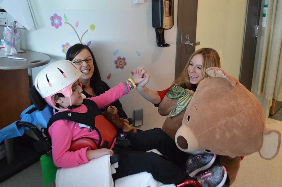 StormTeam 5's Danielle Vollmar hands out teddy bears