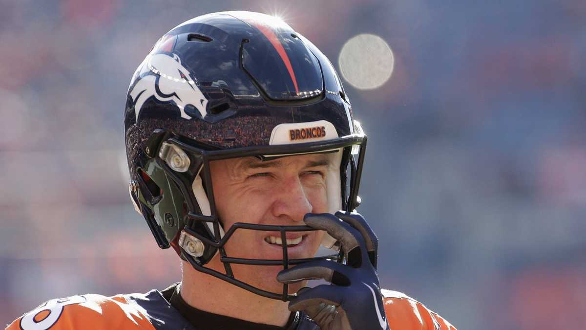 Peyton Manning of the Denver Broncos warms up prior to playing in