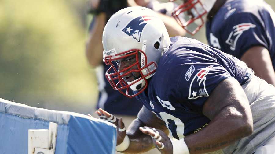 FILE - New England Patriots rookie defensive lineman Ron Brace takes on the blocking sled during NFL football training camp at Gillette Stadium in Foxborough, Mass. Saturday, Aug. 1, 2009. 