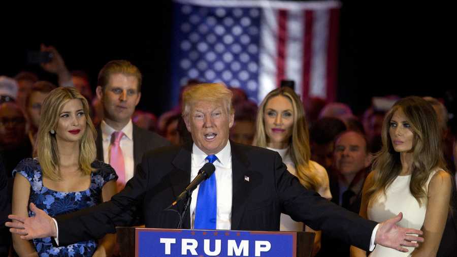 Republican presidential candidate Donald Trump is joined by his wife Melania, right, daughter Ivanka, left, and son Eric, background left, as he speaks during a primary night news conference, Tuesday, May 3, 2016, in New York.