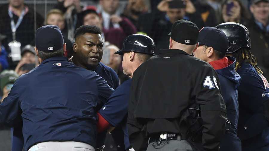 Boston Red Sox manager John Farrell, left, and teammates push designated hitter David Ortiz, second from left, away from umpire Ron Kulpa (46) as Ortiz reacts to a called second strike off of New York Yankees relief pitcher Andrew Miller n the ninth inning of a baseball game, Friday, May 6, 2016, in New York. The Yankees won 3-2. Both Farrell and Ortiz were ejected from the game.