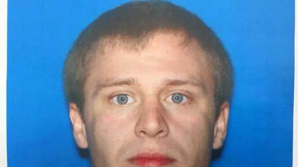 Police search for man accused of stabbing neighbor 35 times