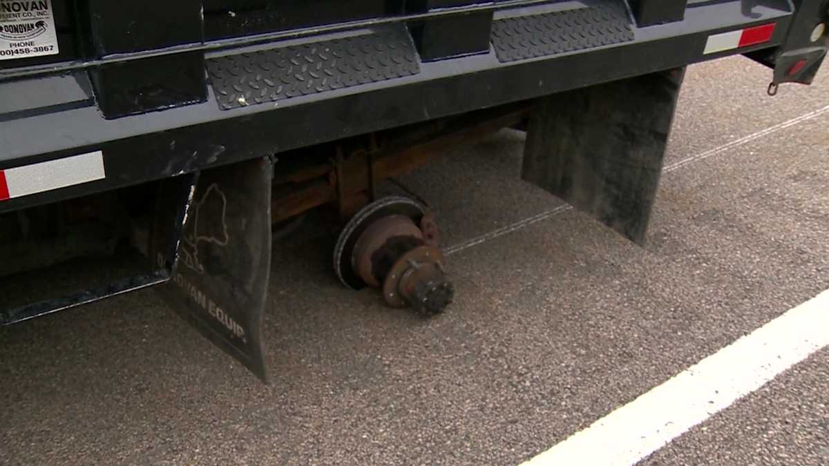 Truck axle breaks on highway; flying tire strikes vehicle