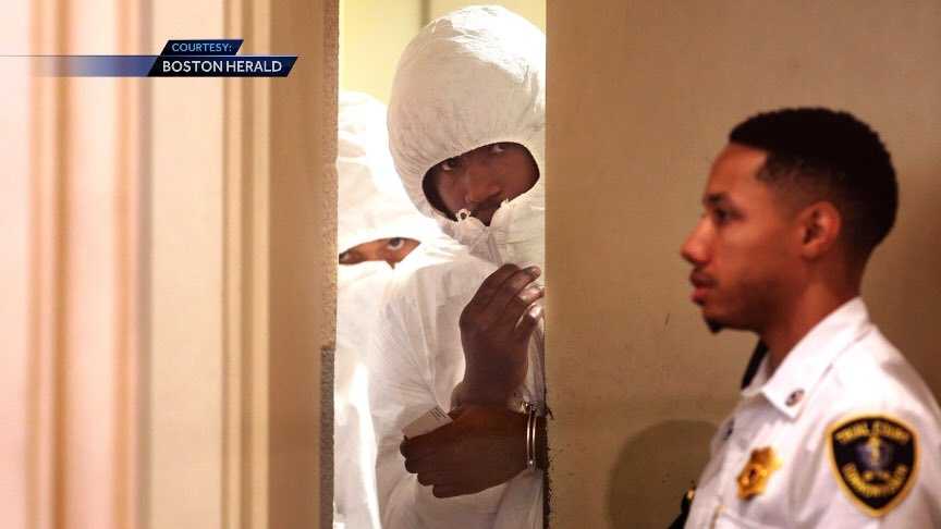 Men accused of killing high school student hide faces in court