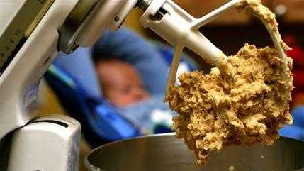 In this undated file photo, cookie dough clings to the beaters of a standing mixer. The Food and Drug Administration issued a warning on June 28, 2016, that people shouldn't eat raw dough due to an ongoing outbreak of illnesses related to a strain of E. coli bacteria found in some batches of flour. 