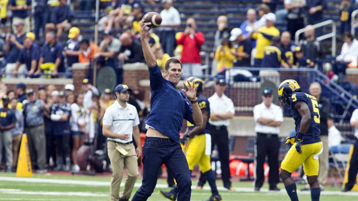 Michigan quarterback Tom Brady (10) stands on the field during a NCAA  football game against Indiana in Bloomington, Indiana on Saturday, October  30, 1999. The Michigan Wolverines defeated the Indiana Hoosiers 34-31. (