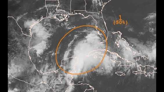 An area of low pressure near the Yucatan Peninsula has a 50 percent chance of developing into a tropical cyclone, the NHC said.