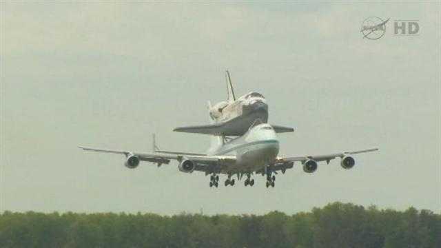 The space shuttle was scheduled to fly over the Stennis Space Center in Mississippi and NASA's Michoud Assembly Facility in New Orleans East on Monday morning but now the flight is scheduled for Tuesday due to weather.